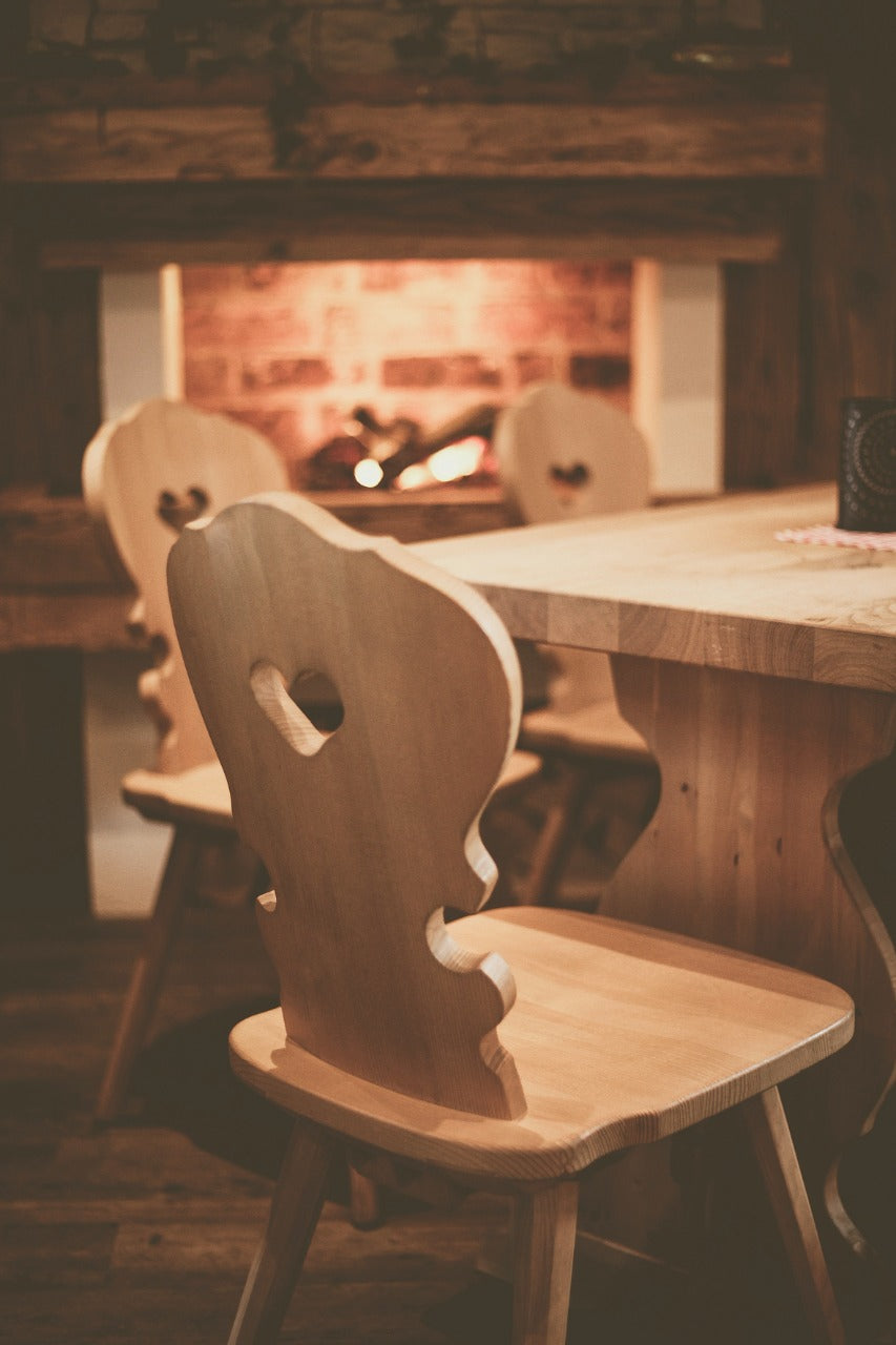 A picture containing floor, indoor, chair, wooden