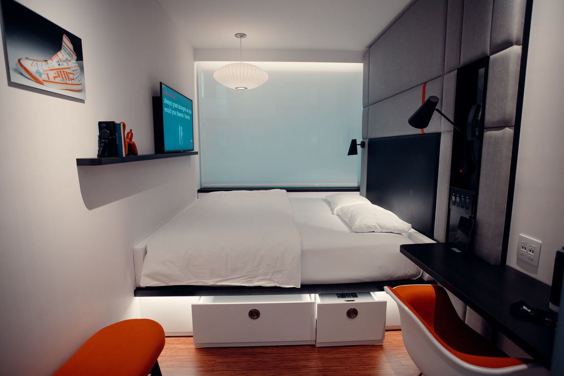 A bedroom with a bed and a tv